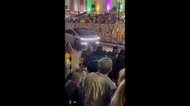 People boo a Cybertruck with an American flag during Mardi Gras parade in New Orleans