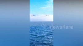 City appears to eerily float in the clouds in China