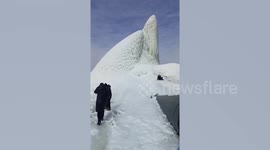 Burst pipe creates ice mountain in Russia