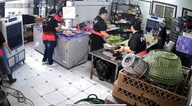 Clumsy cook slips on Thai restaurant kitchen floor