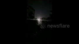 Israeli army’s fire illumination flares east of Gaza City as naval gunboats open fire along the sea coast