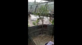 Bridge weakened by surging river collapses in Indonesia