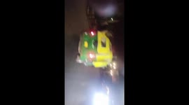 Passengers seen riding on the roof of overloaded rickshaw in India