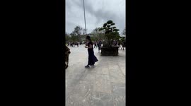 Fashion fail! Mother's dress matches group of tourists