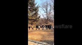 Bizarre fitness craze sees Chinese pensioners laugh hysterically in public park