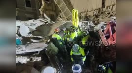 Woman trapped under collapsed building for 24 hours is rescued in Italy