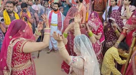 Indian housewives beat men with bamboo shafts at Hindu festival