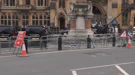 King Charles and Queen Camilla arrive at Westminster Abbey to chorus of boos by anti-monarchy protesters