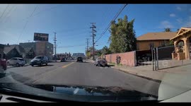 Backward Driver Speeds Through Red Light