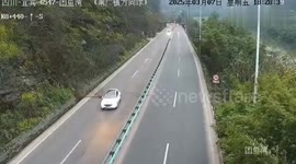 Cars swerve to avoid landslide crashing onto highway in China