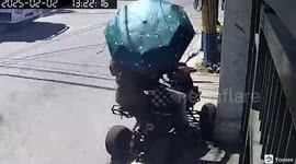 Youngsters riding an electric bike crash into a family's garden gate