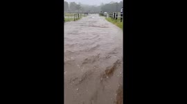 Flash floods surge through farm in Queensland, Australia