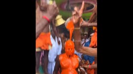 Person anointed with chili liquid during Thaipusam festival in Sidthathur village