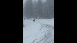 Person sledding on snow falls down in Oslo Norway