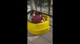 Teen falls after getting dizzy on a playground merry-go-round in Buenos Aires, Argentina