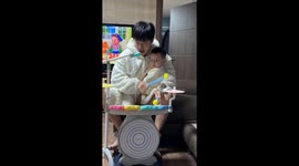 Father and child play drums and sing together in Jeonju-si, South Korea