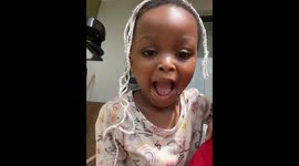 Toddler calls herself pretty and a princess while playing with a mop string