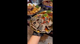 Try this spicy bullfrog stuffed with eggs at restaurant in Thailand