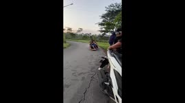 Friends riding wooden skate crash into scooter in Kediri, Indonesia