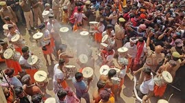 Vibrant scenes as thousands gather to celebrate Holi in northern India