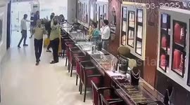 Armed robbers caught on camera raiding jewellery store in India