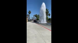 Cars Using Broken Fire Hydrant as Free Car Wash