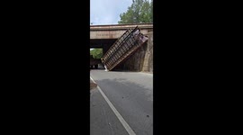 Truck's raised bed causes severe collision with bridge *Aftermath*