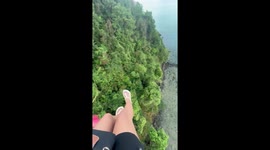 Tourist looks on nervously when zipline breaks 300ft above ground