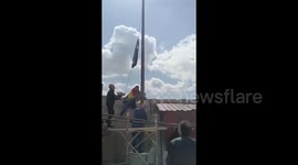 Syria: Raising the Syrian flag over the governorate building in As-Suwayda province by activists and residents of the city