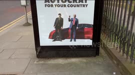 Mock 'Tesla Swasticar' advert appears on a bus stop in London,