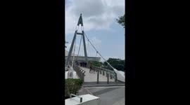 Girl crashes into bush while rollerblading down bridge