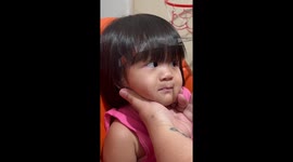 Mother uses adhesive tape to cut daughter's perfect micro fringe