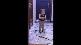 Child mimics smoking and drunken walk in Tashkent, Uzbekistan