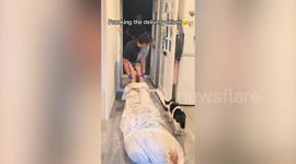 Woman pranks delivery driver by pretending she's murdered her husband