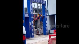 Chinese factory workers dangle in air as 'punishment' for not wearing safety gear