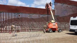 US Marines reinforce Trump border wall with razor wire