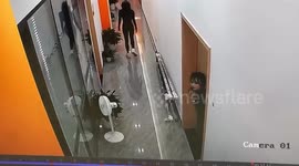 Office worker caught on camera taking an embarrassing tumble