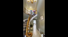 Playful Nan Slides Backward Down Banister