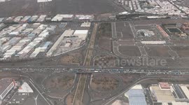 Title: Massive Traffic Jam on GC-1 in Gran Canaria – March 14, 2025  Description: Aerial footage captured from a plane shows an unprecedented traffic jam on the GC-1 motorway in Gran Canaria, stretching from Vecindario all the way to Las Palmas. The conge