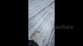 China: Slipping on Ice While Skating on the Road