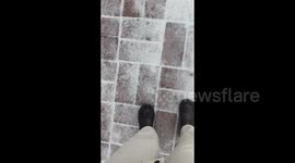 China: People Sliding On Icy Ground Due To Strong Winds