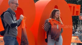 Participants in the Rome Marathon take souvenir photos in front of the large number 30 that was installed at the Expo Village where bibs and gadgets are collected at the Palazzo dei Congressi in Rome.