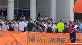 Participants in the Rome Marathon line up to collect their bibs and gadgets at the Expo Village at the Palazzo dei Congressi in Rome.