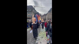 US President and middle finger hats during Fastnacht Carnival in Switzerland