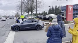 Demonstrators Protest Outside a Tesla Showroom in Seattle