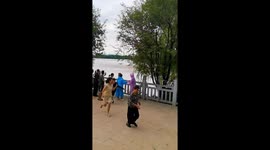 Sudden tidal surge knocks over Chinese tourists in Hangzhou