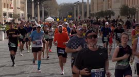 Runners run along Via della Conciliazione and at a certain point some of the organization's operators change the race route during the Acea Run Rome The Marathon in Rome.