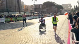 A disabled athletic man starts his race aboard his handbike during the Acea Run Rome The Marathon in Rome.