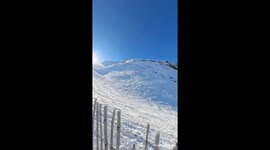 Snowboarder Crashes Over Fence