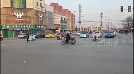China: The elderly man sang as he pedalled his tricycle.